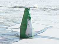 Light buoy in icy waters