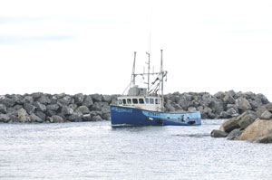 Photo of a fishing vessel returning to port