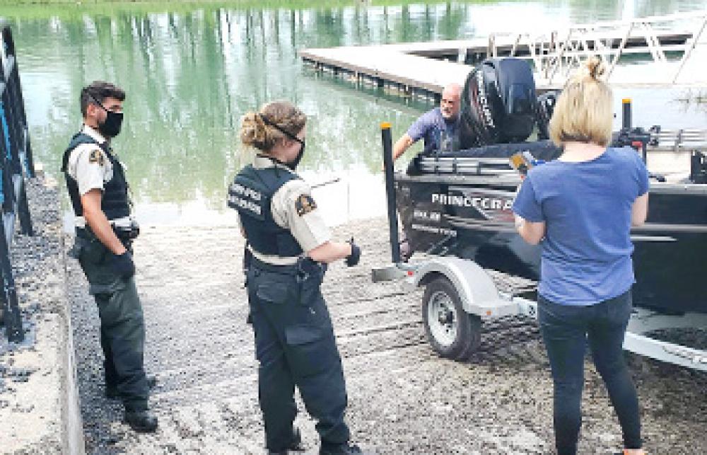 Fishery officers discussing with the public