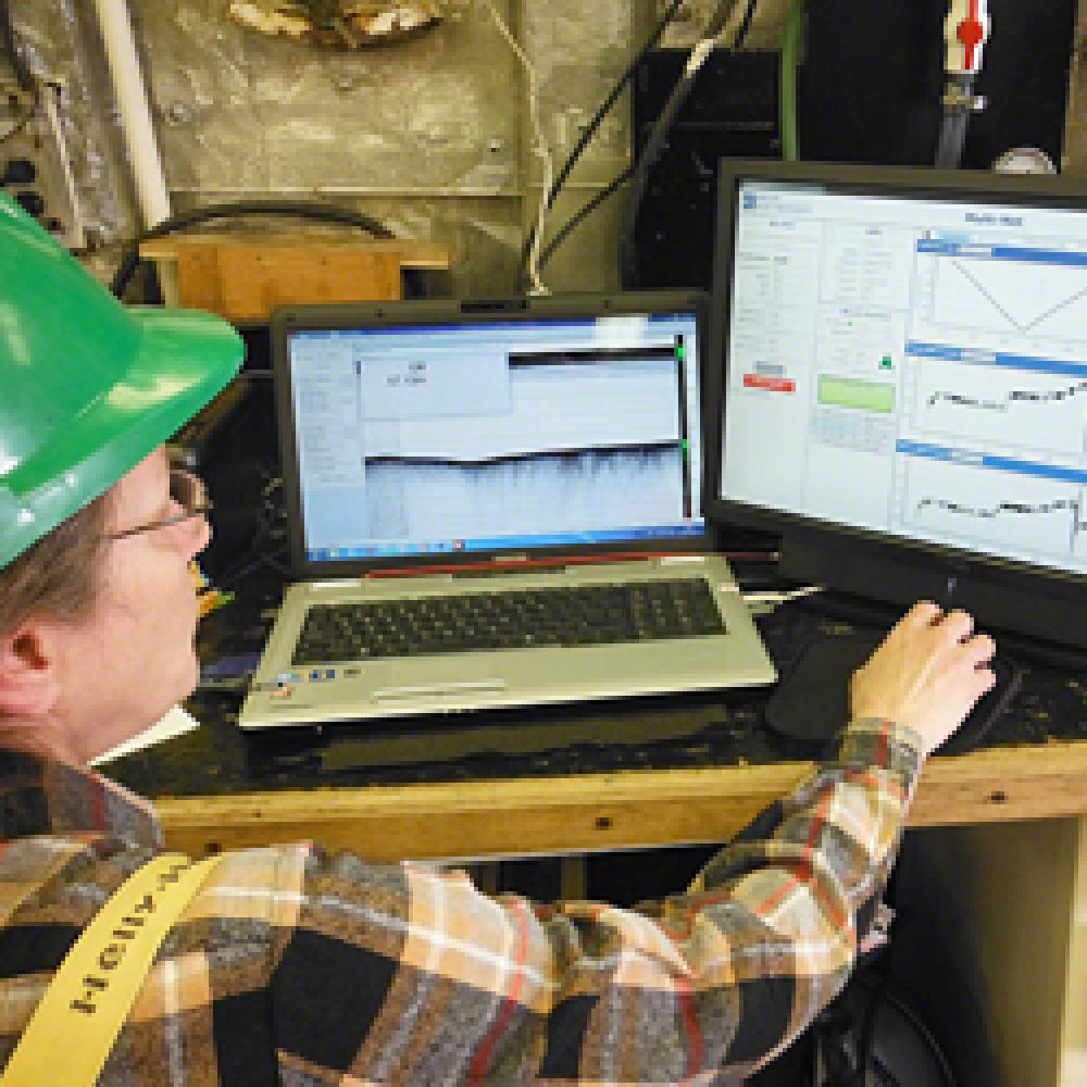 A scientist uses the computer to analyze temperature and salinity contours