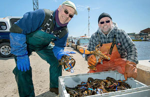 Gaspé fishermen proudly display their catches